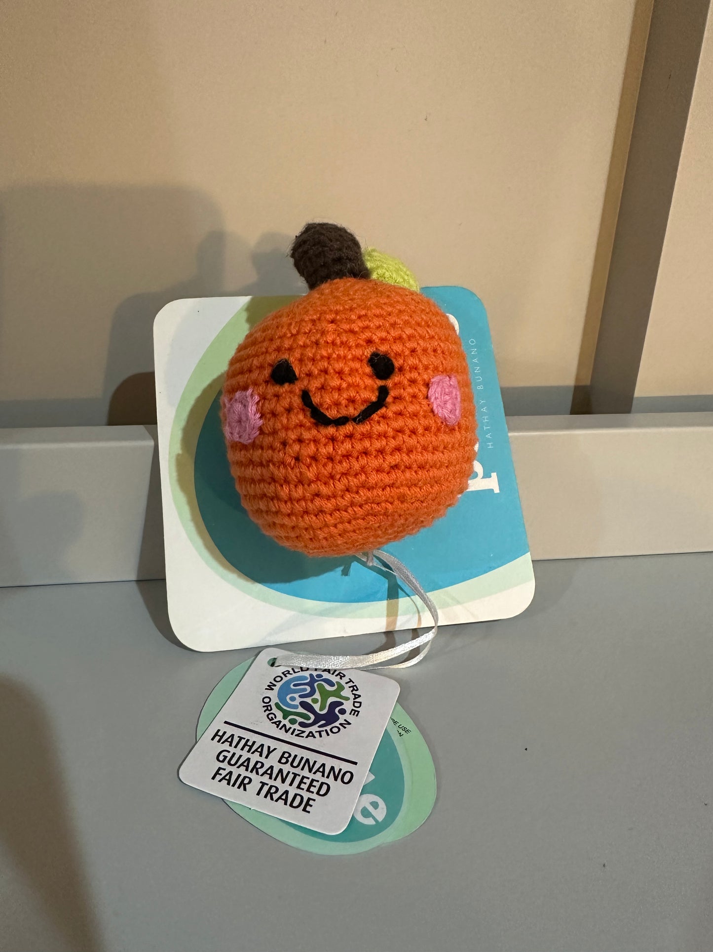 Pebble Fairtrade Knitted Orange Fruit Baby Rattle